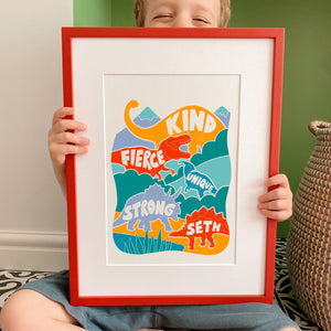 Boy holding kid's personalised bright Dinosaur positive name print