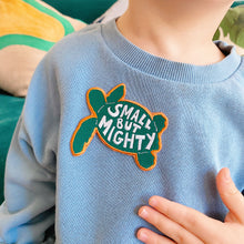 Load image into Gallery viewer, &#39;Small but mighty&#39; kids embroidered badge, green, white and yellow, sewn onto children&#39;s sweater.
